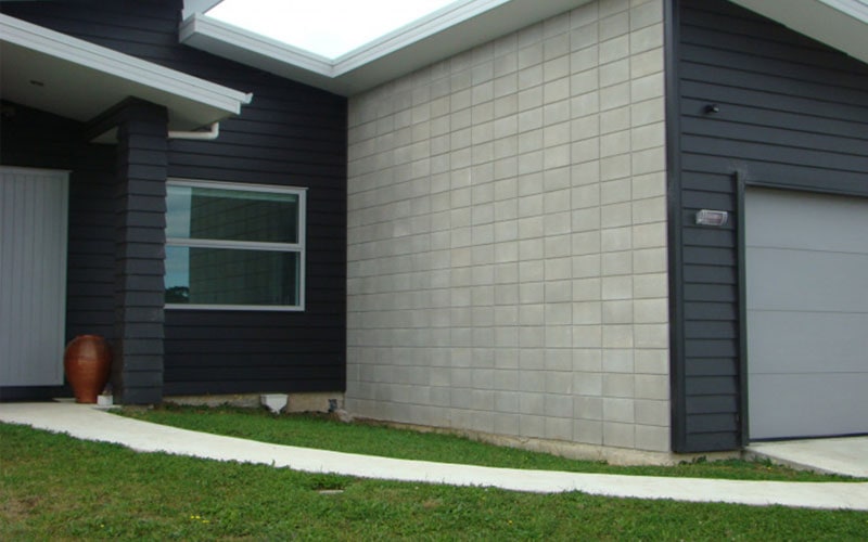 Modern home with concrete block wall and cladding, showing a house type suitable for residential flood protection