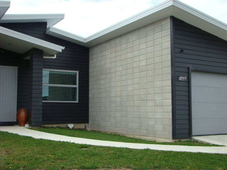 Modern home with concrete block wall and cladding, showing a house type suitable for residential flood protection